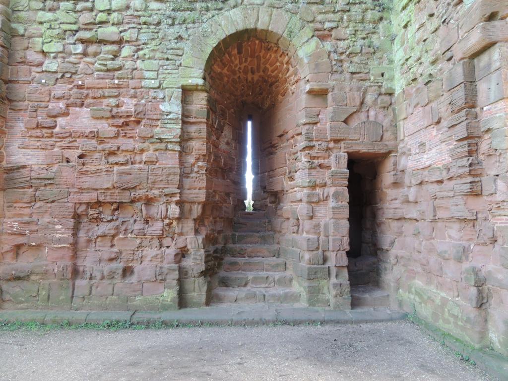 The thin windows of the time that protected against attack but allowed little light