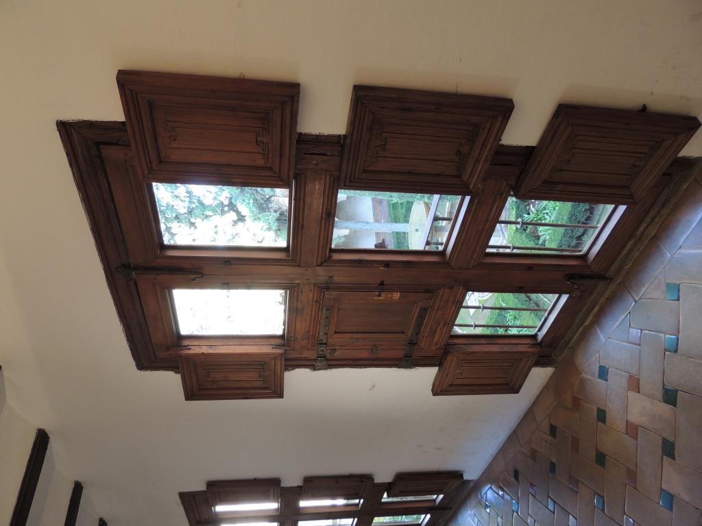 Many panelled doors offering different views of the court yard