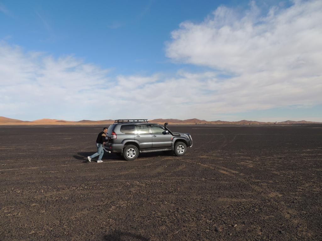 Mohammed "pushing" the car as it idles along