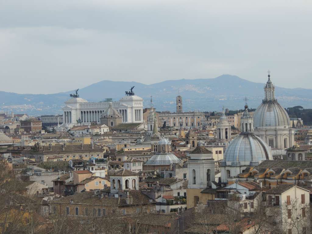 Views of Rome. The chariots on Monumento Vittorio Emanuele II can be seen in the background with (part of) the Colosseum to the left