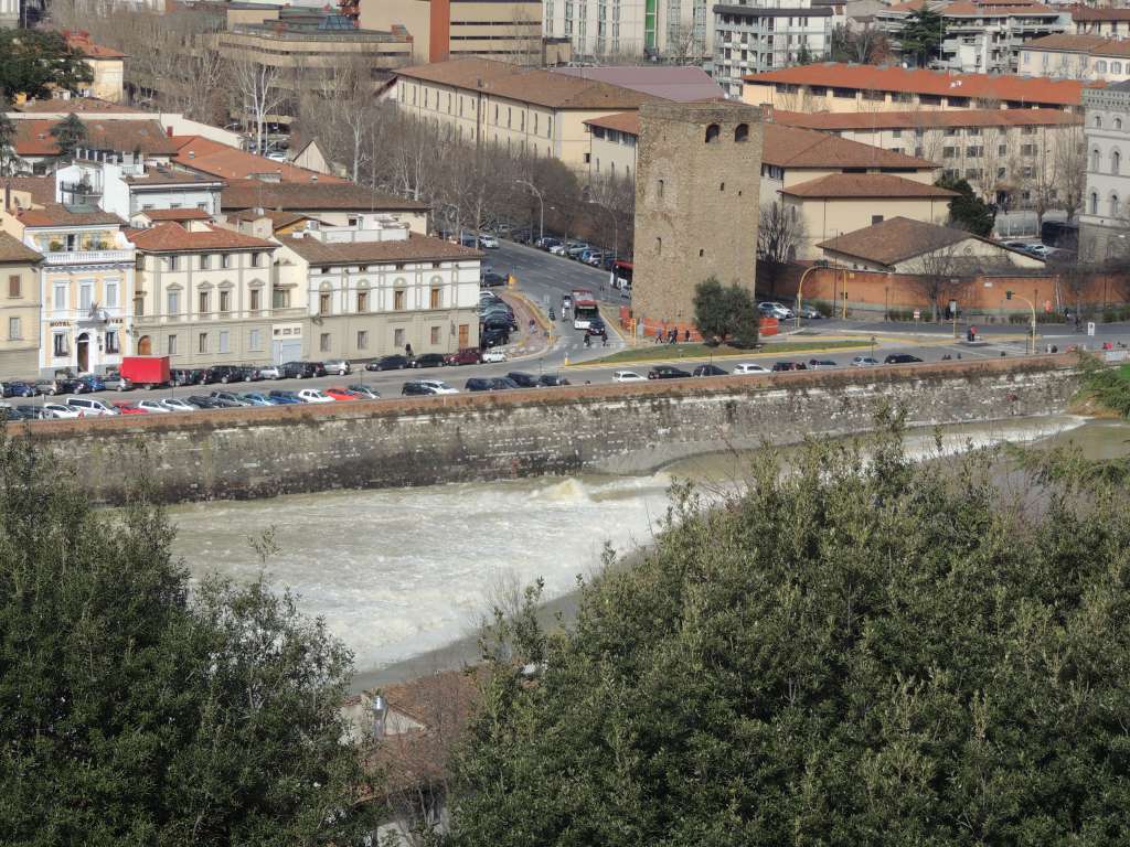 The Arno river was quite high and flowing very hard. The city has been flooded many times.