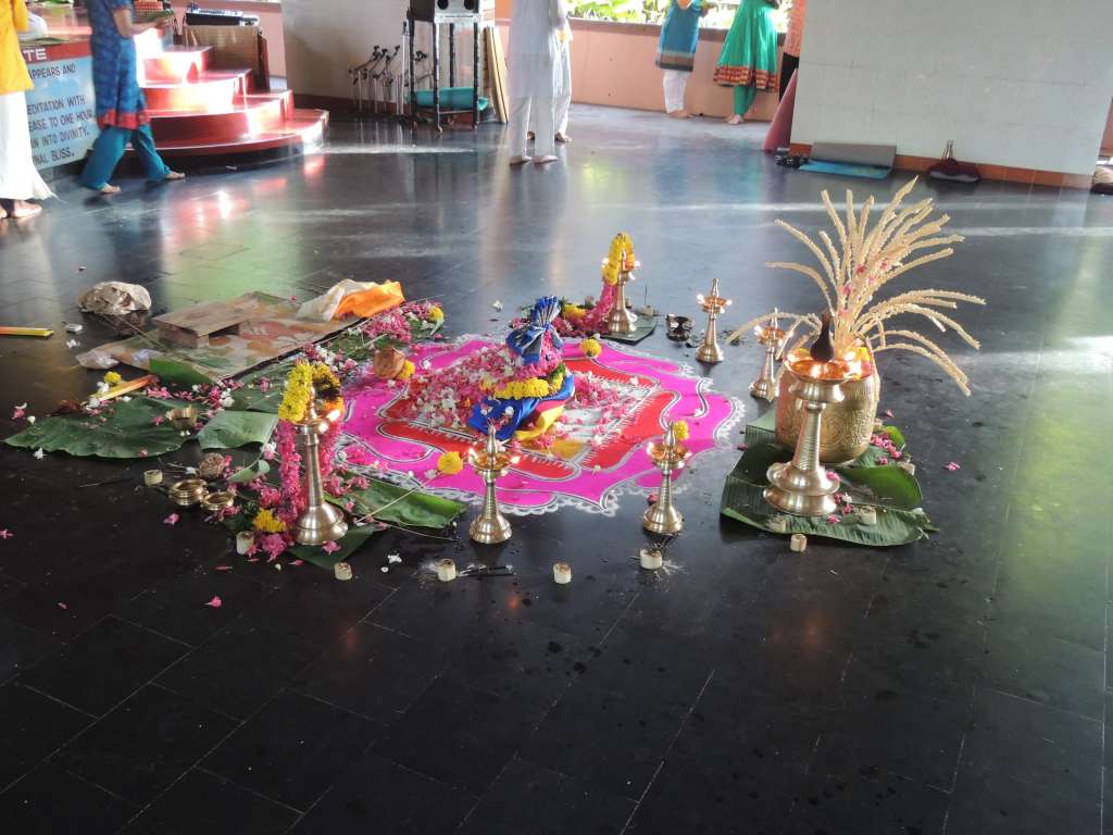 The display after the priest had done his thing and we'd all thrown flowers on it.