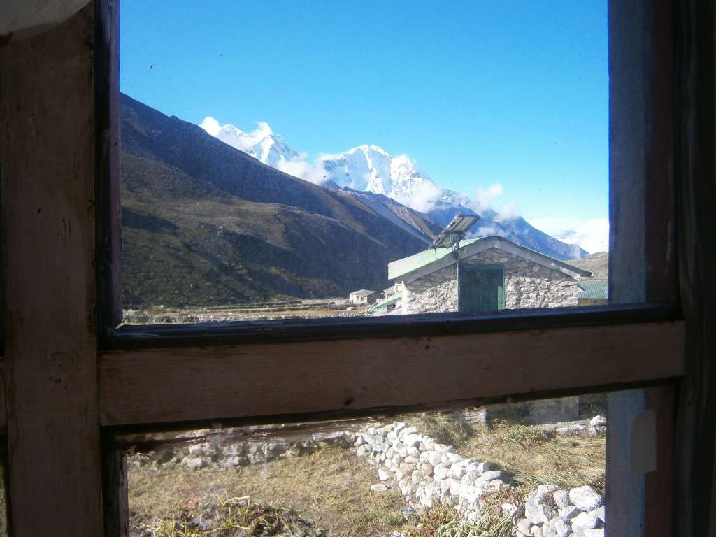 View from our bedroom window of snow topped mountains in Dingbouche