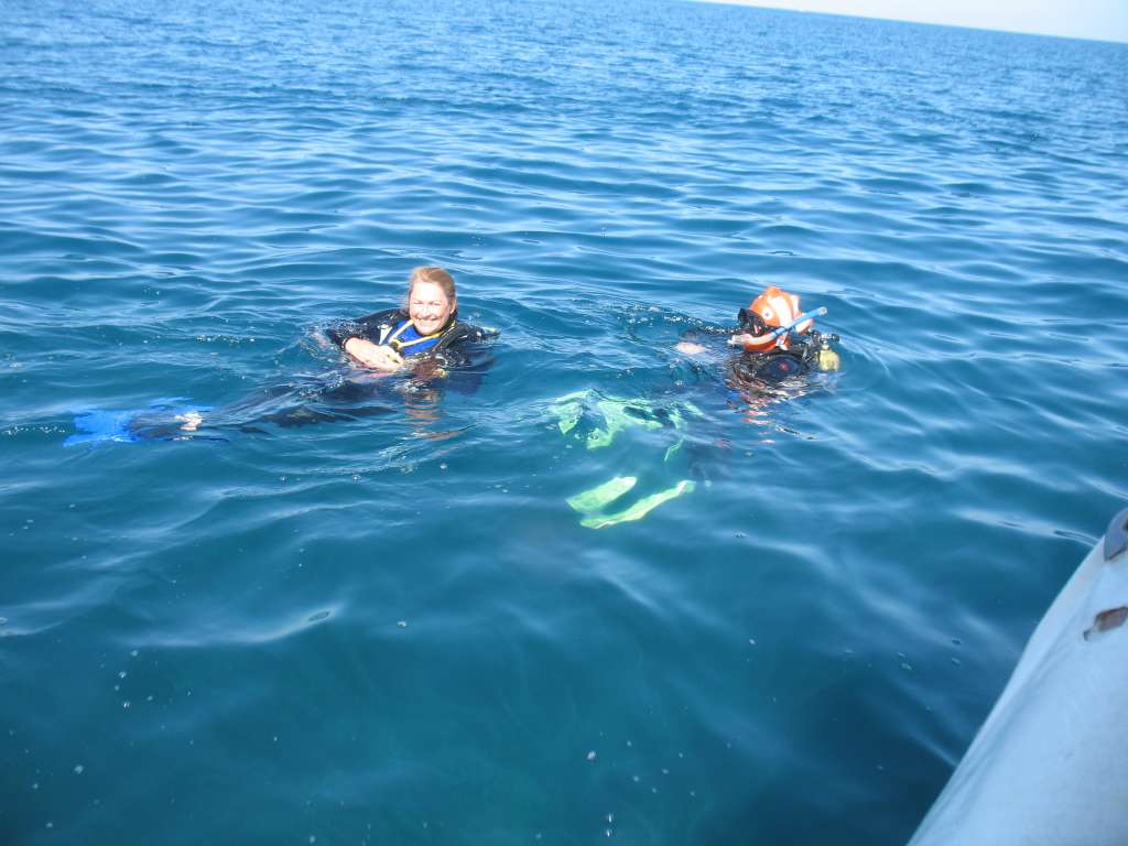 Us with Karen, a lovely expat who helped us learn to breathe underwater.